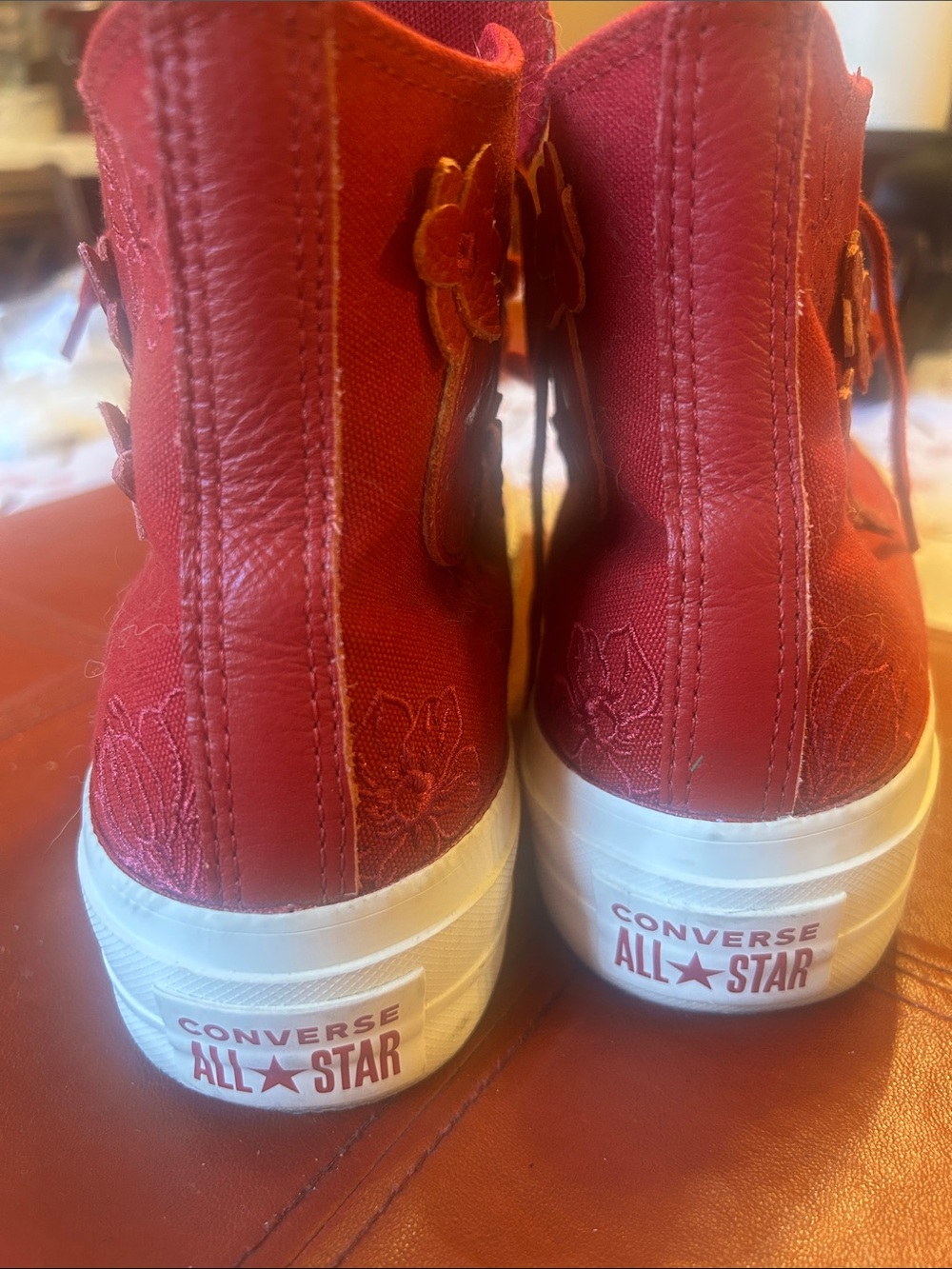 Converse women’s red embroidered sneakers